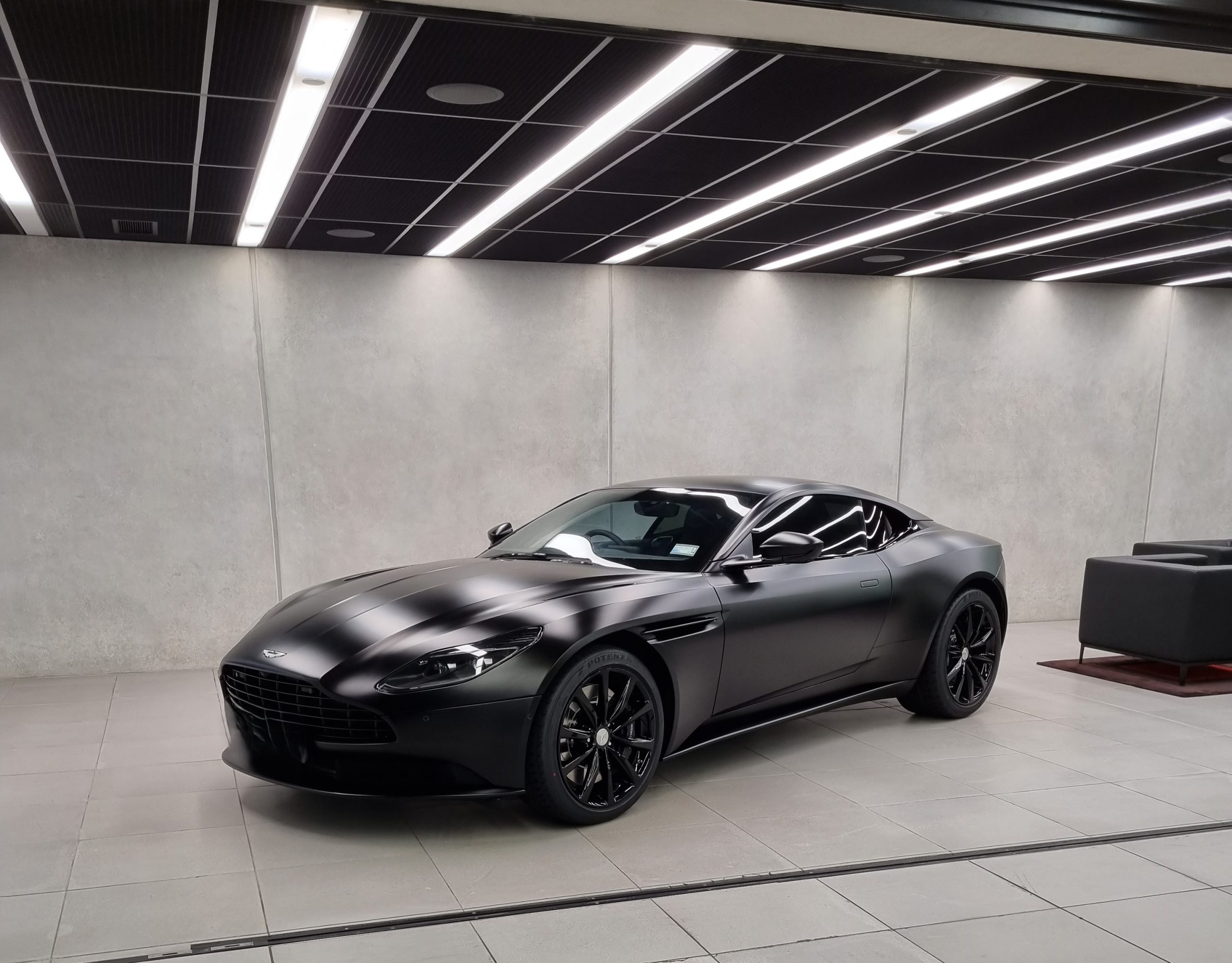 Grey sports car checked and approved for a client